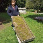 stonemason Sam Kelly taking the Seat of Remembrance away for repair