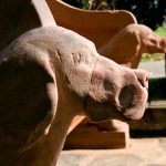 closeup of one of the stone dogs on the restored Seat of Remembrance