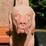 closeup of one of the stone dogs on the restored Seat of Remembrance