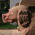 closeup of one of the stone dogs on the restored Seat of Remembrance