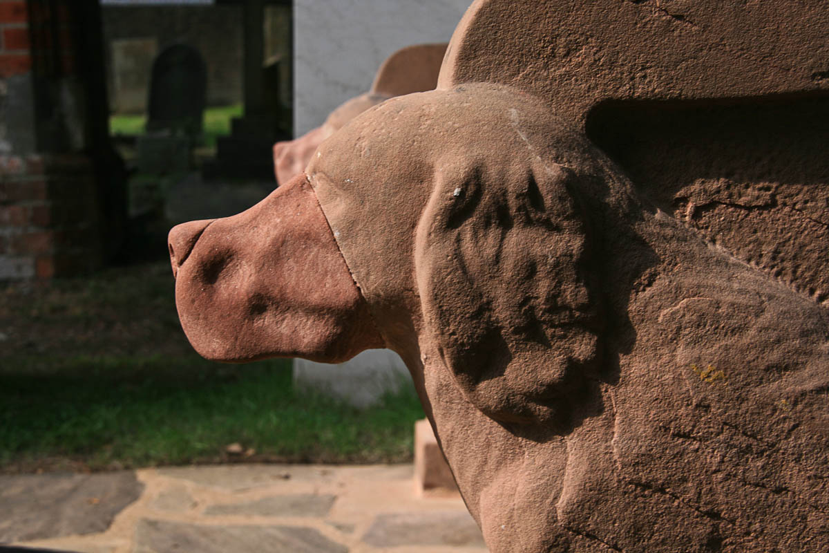 closeup of one of the stone dogs on the restored Seat of Remembrance