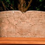 closeup of one of the inscription bearing the words Seat of Remembrance surrounded by heraldic wings